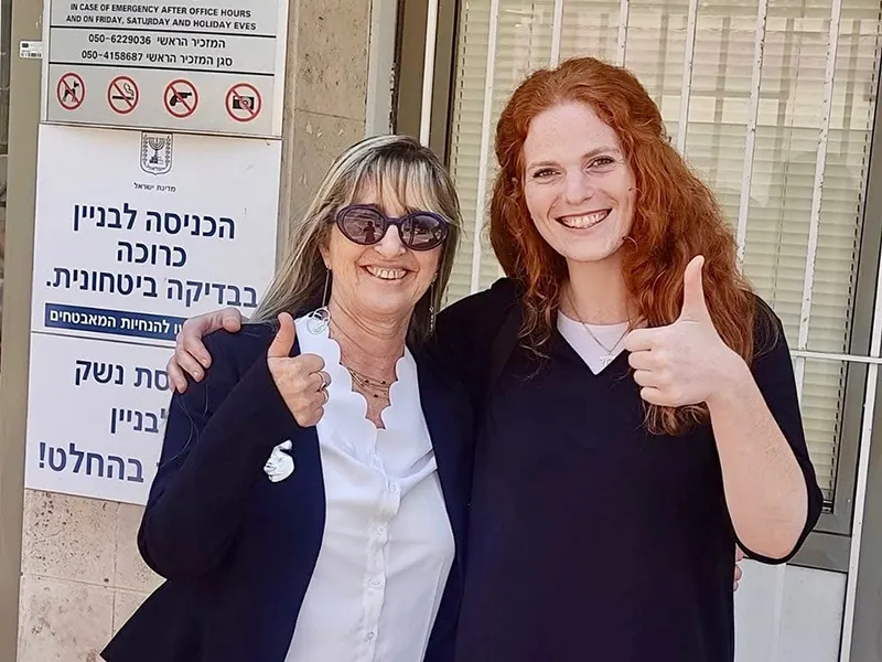 grantmaking-eligibility-application two women giving the thumbs up